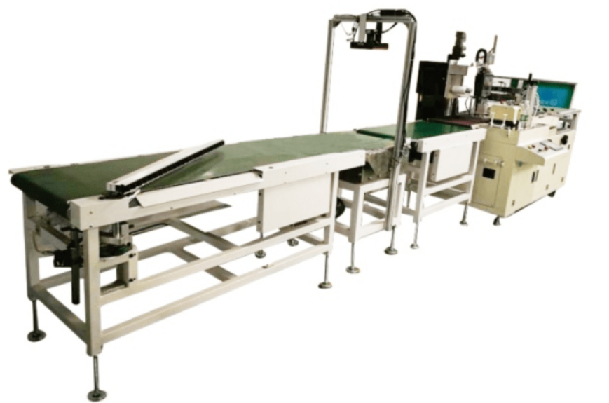 Shrink wrapping machine